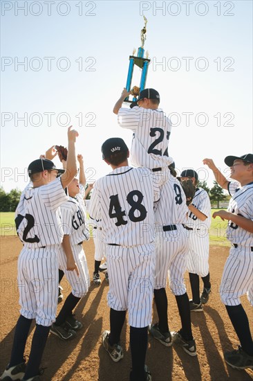 USA, California, Ladera Ranch, Boys (10-11) from Little league celebrating after winning.