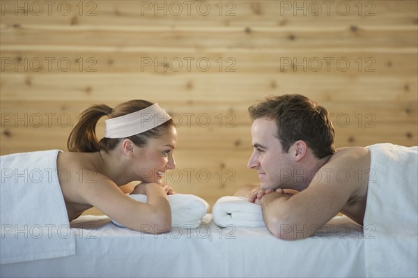 USA, New Jersey, Jersey City, Portrait of young couple lying in spa.