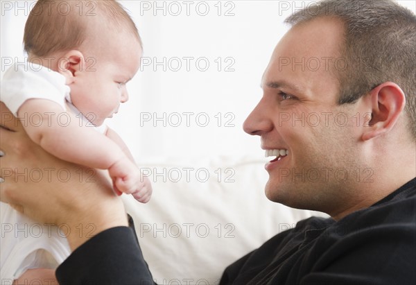 USA, New Jersey, Jersey City, Portrait of father and baby daughter (2-5 months). Photo : Jamie Grill Photography