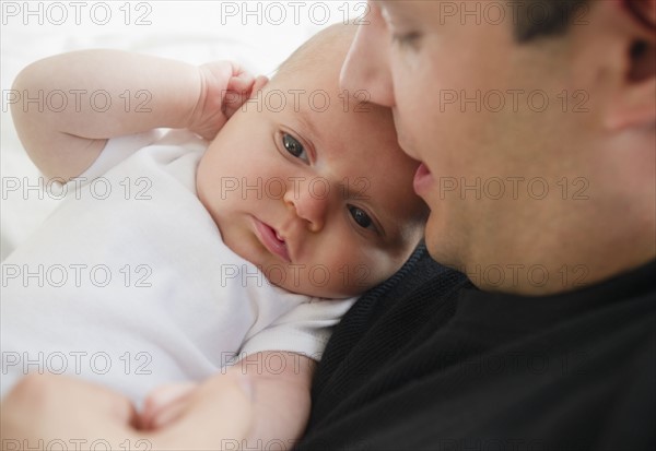 USA, New Jersey, Jersey City, Portrait of father and baby daughter (2-5 months). Photo : Jamie Grill Photography