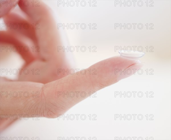 USA, New Jersey, Jersey City, Close-up view of woman hand with contact lens. Photo : Jamie Grill Photography