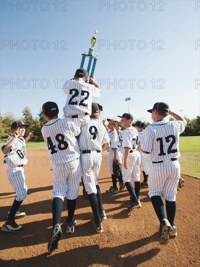 USA, California, Ladera Ranch, Boys (10-11) from Little league celebrating after winning.