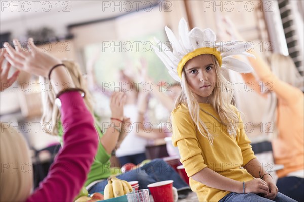 USA, Utah, family portrait of sisters (6-7, 8-9, 12-13, 14-15, 16-17) having fun at table. Photo : Tim Pannell