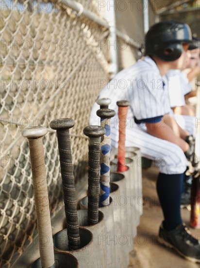 USA, California, Ladera Ranch, Boys (10-11) from little league sitting on dugout.