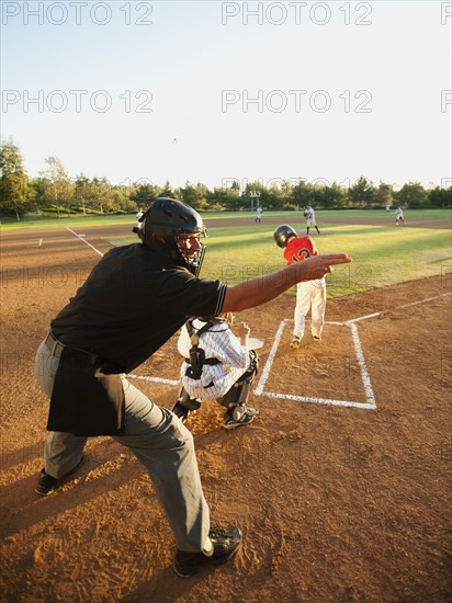 USA, California, Ladera Ranch, boys (10-11) playing baseball.