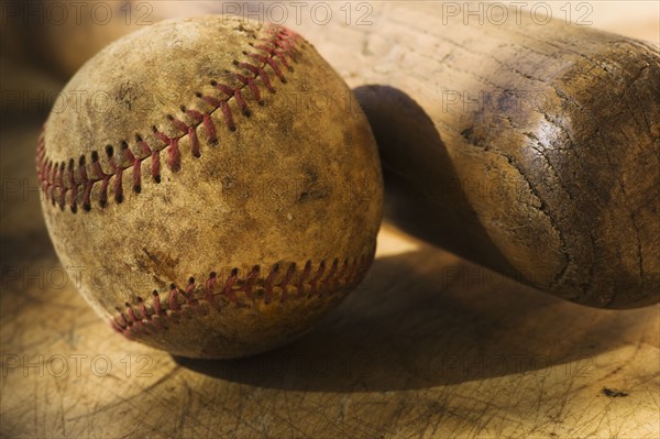 Antique baseball with baseball bat.