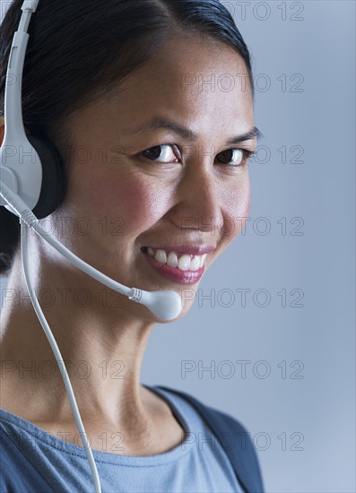 Studio portrait of female call centre worker.