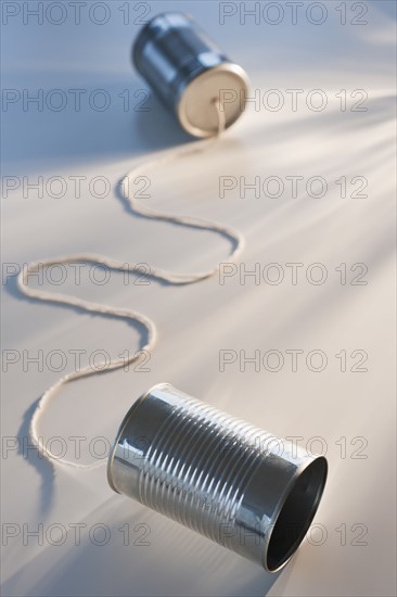 Tin can phone on white background. Photo : Daniel Grill