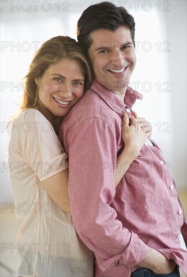 USA, New Jersey, Jersey City, Portrait of couple embracing, smiling.