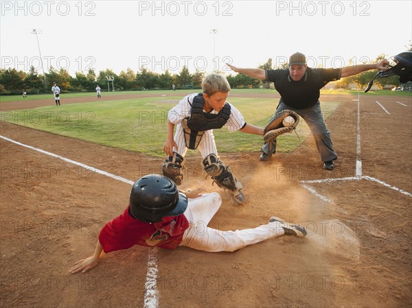 USA, California, Ladera Ranch, boys (10-11) playing baseball.