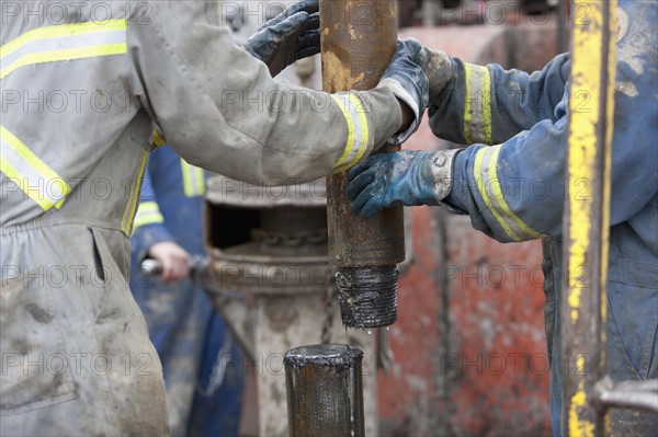 Oil workers drilling for oil on rig. Photo : Dan Bannister