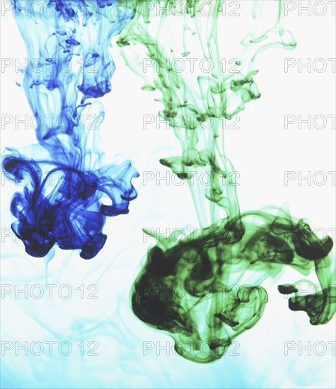 Studio shot of green and blue dye in abstract shape. Photo : David Arky
