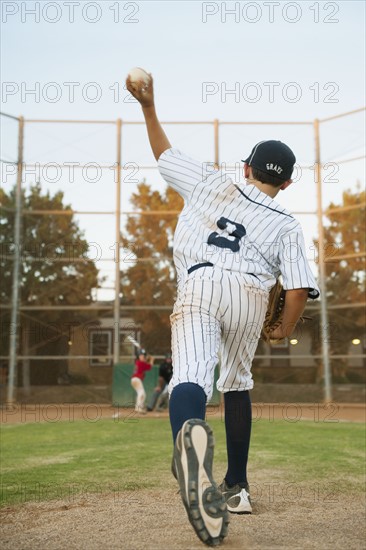 USA, California, Ladera Ranch, boy (10-11) playing baseball.