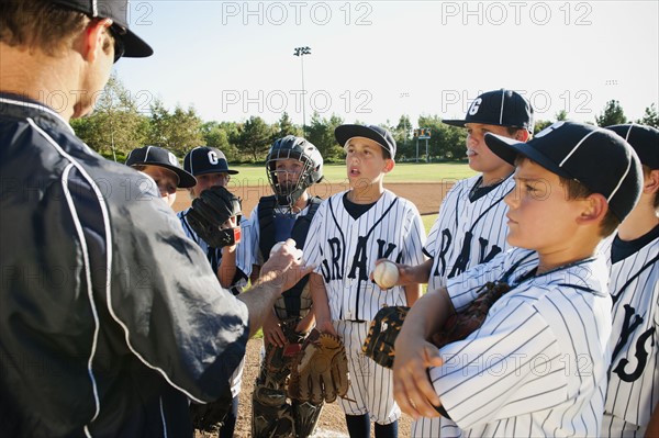 USA, California, Ladera Ranch, coach training little league baseball team (10-11).