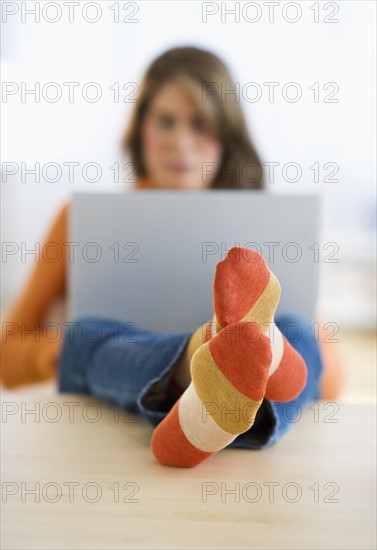 USA, New Jersey, Jersey City, Woman using laptop in home.