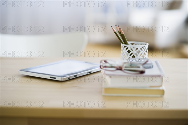 USA, New Jersey, Jersey City, Digital tablet and stationery on desk.