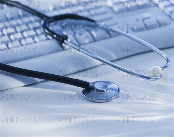 Close-up view of blue globe with stethoscope. Photo : Daniel Grill