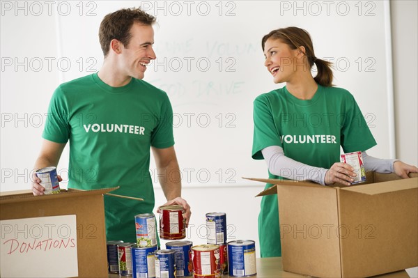 USA, New Jersey, Jersey City, Two young people as volunteers.