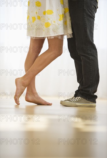 USA, New Jersey, Jersey City, Legs of two people standing face to face.