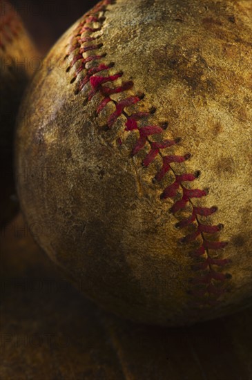 Antique baseball on wooden floor.