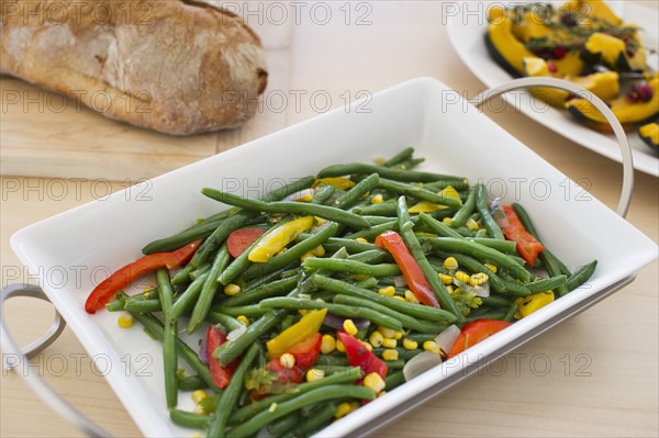 USA, New Jersey, Jersey City, Plate of cooked vegetables on table.