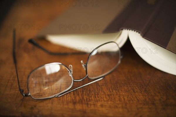 USA, New Jersey, Jersey City, Eyeglasses and open book.