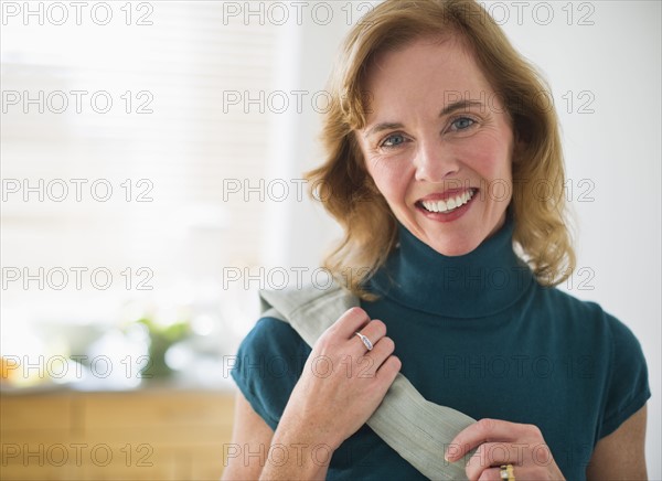 USA, New Jersey, Jersey City, Portrait of woman in kitchen.