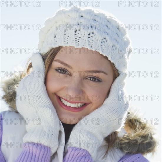 USA, New Jersey, Jersey City, Portrait of young woman wearing white knitted hat.