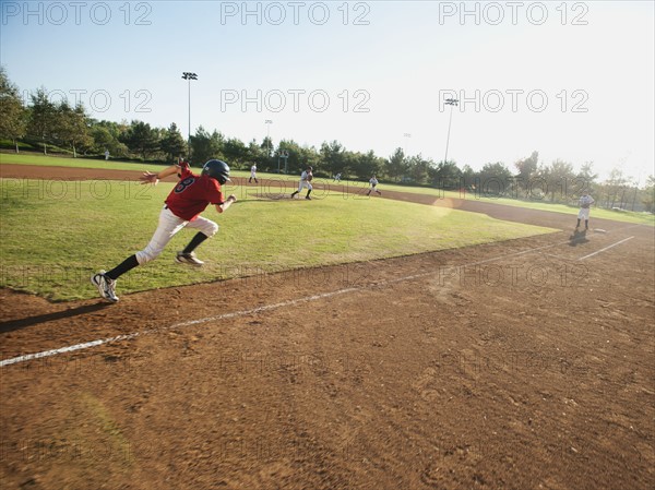 USA, California, little league baseball team (10-11) during baseball match.