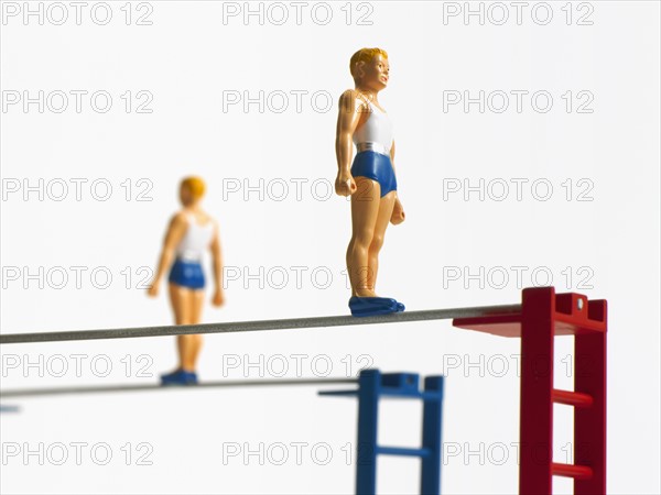 Studio shot of figurines on ladders. Photo : David Arky