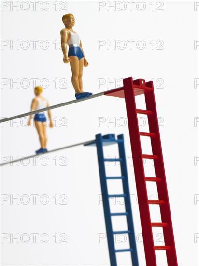 Studio shot of figurines on ladders. Photo : David Arky