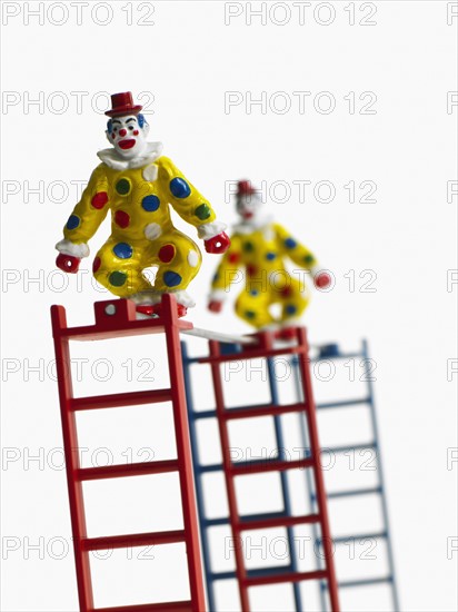 Studio shot of figurines on ladders. Photo : David Arky
