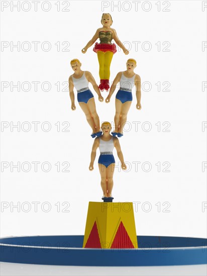 Studio shot of figurines of acrobats. Photo : David Arky