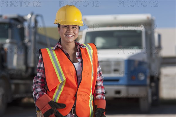 Portrait of female construction worker on building site. Photo : Dan Bannister