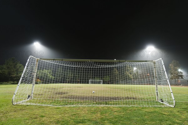 USA, California, Ladera Ranch, illuminated soccer field at night.