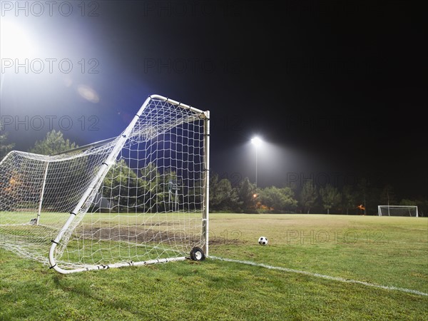 USA, California, Ladera Ranch, illuminated soccer field at night.