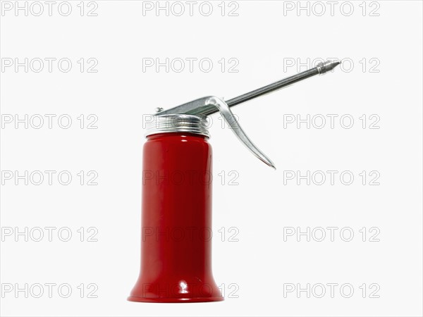 Studio shot of red oil can. Photo : David Arky