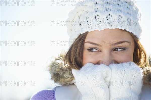 USA, New Jersey, Jersey City, Portrait of young woman wearing white knitted hat.