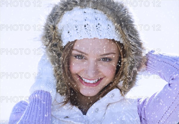 USA, New Jersey, Jersey City, Portrait of young woman wearing white knitted hat.