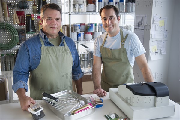 USA, New Jersey, Jersey City, Portrait of hardware shop owner and assistant.