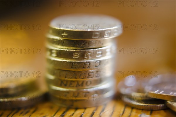Stack of coins on table, close-up.