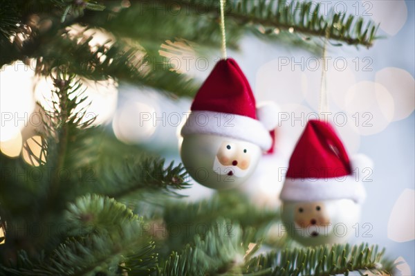 Father Christmas baubles on tree.