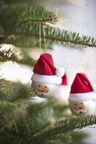 Father Christmas baubles on tree.