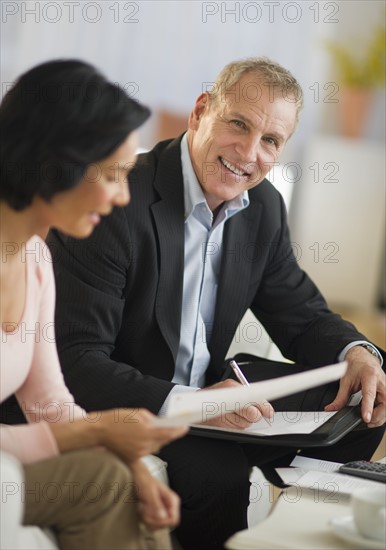 Woman talking to financial advisor.