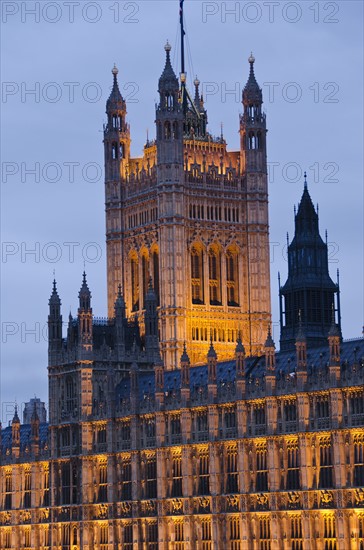 United Kingdom, London, Houses of Parliament illuminated at dusk.