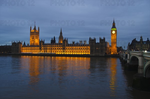 United Kingdom, London, Houses of Parliament illuminated at dusk.