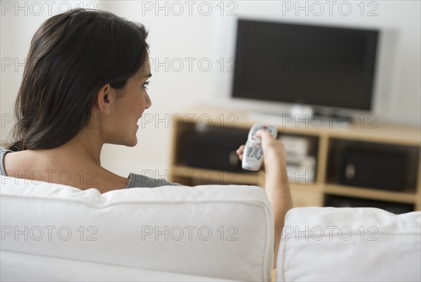 Woman watching tv.