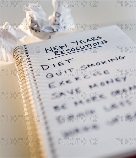 Close up of notebook with list of resolutions for new year. Photo : Jamie Grill Photography