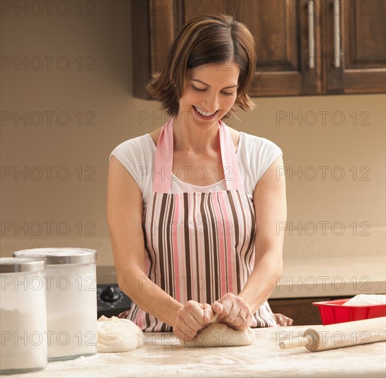 Woman preparing dough. Photo : Mike Kemp