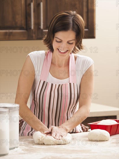 Woman preparing dough. Photo : Mike Kemp